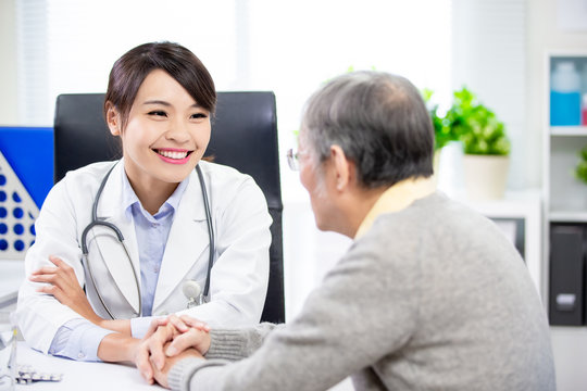 Female doctor see elder patient