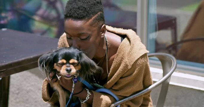 Young Black African American Woman Playing And Kissing A Dog, 4K