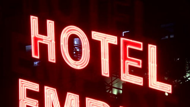 HOTEL sign light ON exterior