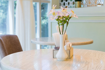 modern restaurant interior with windows and flowers. cafe room illuminated by sunlight