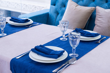 serving banquet table in a luxurious restaurant in blue and light style