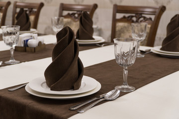 serving banquet table in a luxurious restaurant in brown and white style