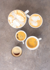 Assorted coffee background. Espresso, cappuccino, americano, mocha cups on cement background, Love coffee concept.