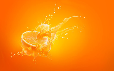 Slide cut piece of orange drop on orange background with orange juice splash water with copy space
