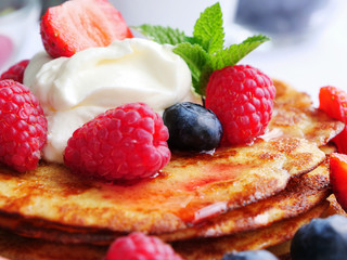 Keto pancakes with berries and whipped cream