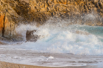 Storm in the sea, the waves beat on the rocks