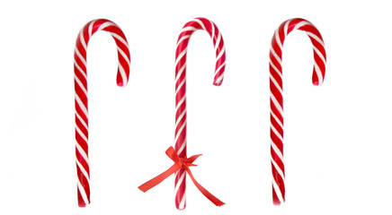 three red candy canes isolated on white background