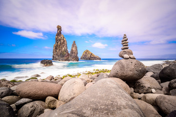 Lava islets in Ribeira da Janela at stony beach - Wild and beautiful coast with rock formations in the ocean near Porto Moniz on the island Madeira, Portugal