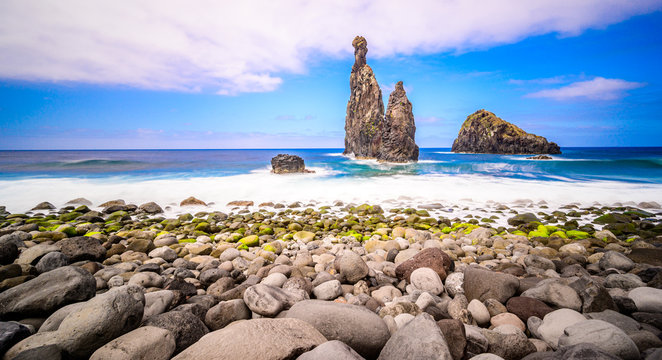 Lava islets in Ribeira da Janela at stony beach - Wild and beautiful coast with rock formations in the ocean near Porto Moniz on the island Madeira, Portugal