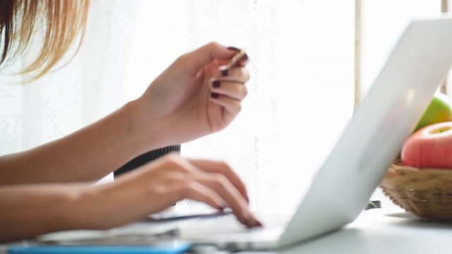 Online Shopping Website on Laptop. Easy E-commerce Website Shop by Smartphone, iPhone, iPad and Laptop. Close up Hands Using Smartphone Shopping Cart Reading Online Article, Blog.