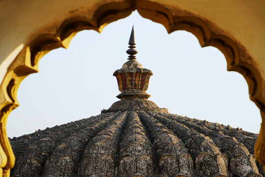 Vitthal Temple at Palashi, Parner, Ahmednagar, Shikhara in stone masonry carving as seen from arched canopy over entrance gate.