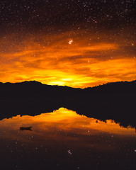 sunset and stars in the mountains - 275400446