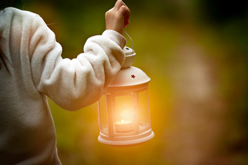 Lantern in hand illuminates the road travel and discoveries