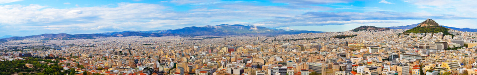Fototapeta na wymiar Panoramic view from the Acropolis from the hill to the other side of the capital Athens on a hot evening, Greece