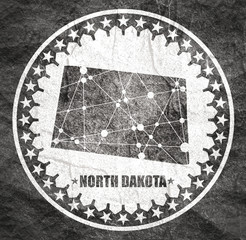 Image relative to USA travel. North Dakota state map textured by lines and dots pattern. Stamp in the shape of a circle