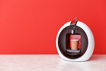 Modern coffee machine on table