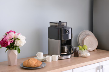 Modern coffee machine in kitchen