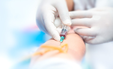 the doctor takes blood on the analysis