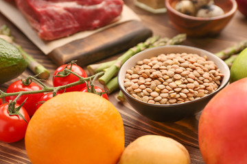 Different healthy food on wooden table