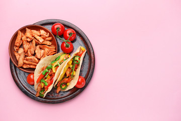 Plate with tasty fresh tacos on color background
