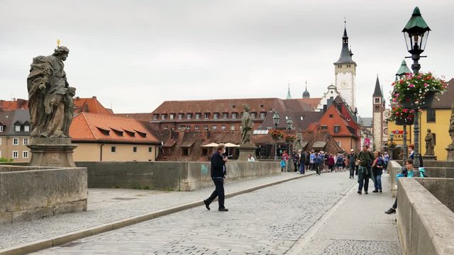 WURZBURG, GERMANY - JUNE 12, 2019: Alte Mainbrucke, the old bridge across the Main river in Wurzburg - Bavaria, Germany
