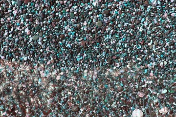 shiny ocean boulders wet by waves texture - pretty abstract photo background