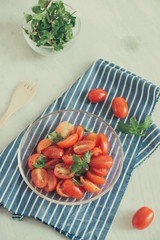 Fresh delicious salad with tomatoes. Doing fresh green salad