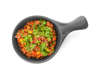 Frying pan with tasty chili con carne on white background