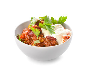 Bowl with tasty chili con carne on white background