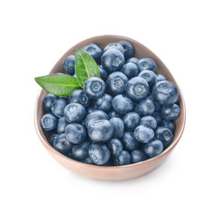 Bowl with ripe blueberry on white background