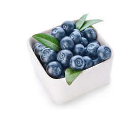 Bowl with ripe blueberry on white background