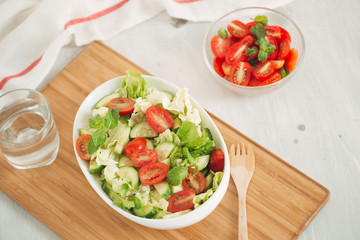 Healthy lifestyle, diet concept. Doing fresh green salad