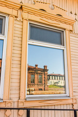 Fototapeta premium Wooden Windows in old houses in the Russian North. Nice shots. Carving. Traditional wood housing
