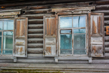 Fototapeta na wymiar Wooden Windows in old houses in the Russian North. Nice shots. Carving. Traditional wood housing