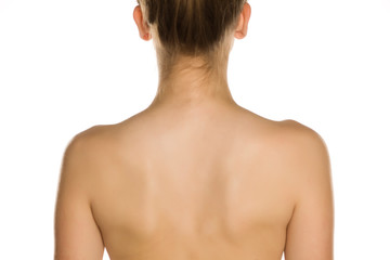 Naklejka premium Nude back of young women on white background