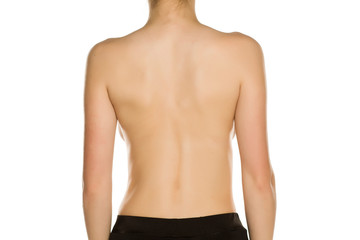 Naklejka premium Nude back of young women on white background