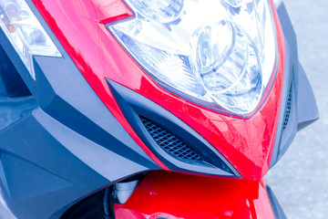 headlight motorcycle red outdoor close up