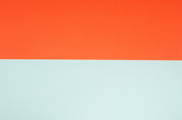 Minimalistic paper background in green and orange.