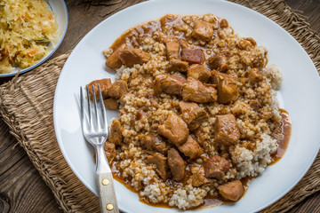 Barley groats with stewed meat.