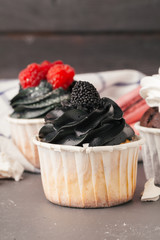 Delicious raspberry cupcakes on dark background - Handmade Sweet dessert