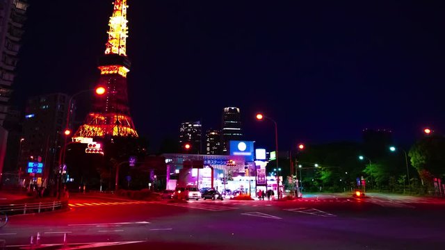 A timelapse at the crossing behind the high tower at night panning. Minato district Tokyo / Japan - 04.27.2019 : Here's called Tokyo tower. camera : Canon EOS 5D mark4