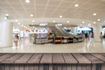 Empty top wood shelves and blurred shopping mall  background. product display template