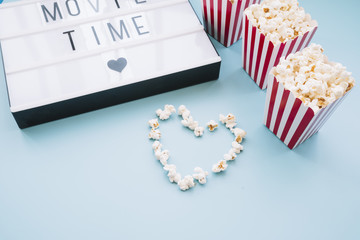 Fototapeta na wymiar Popcorn box with a cinema sign