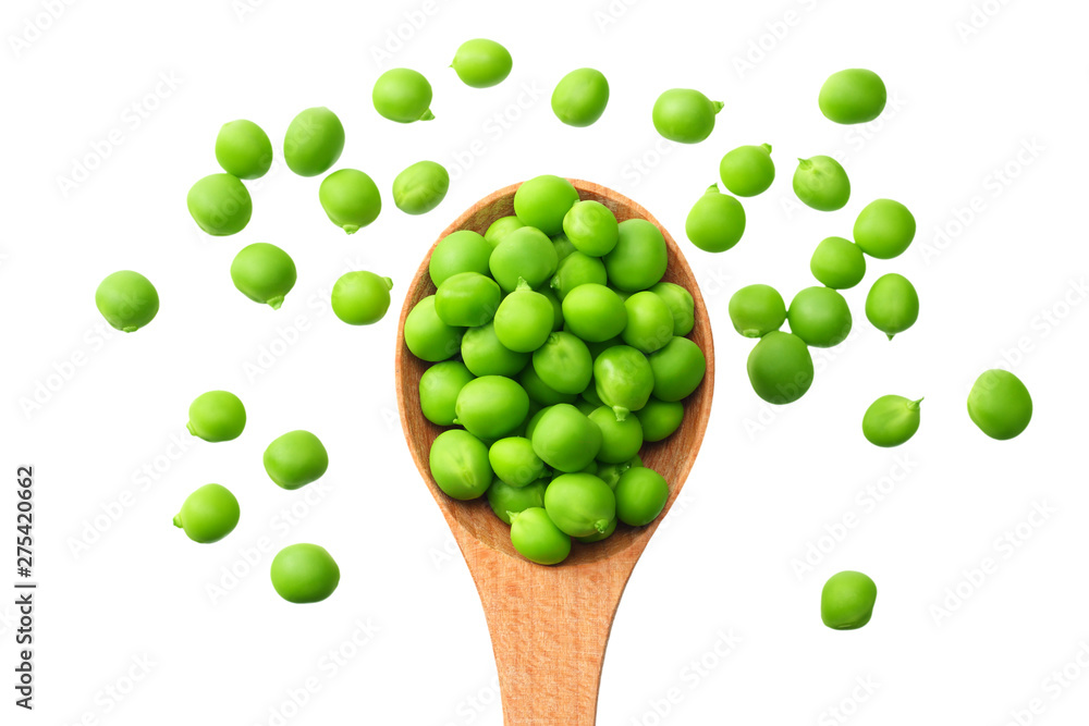 Wall mural fresh green peas in a wooden spoon isolated on a white background. top view