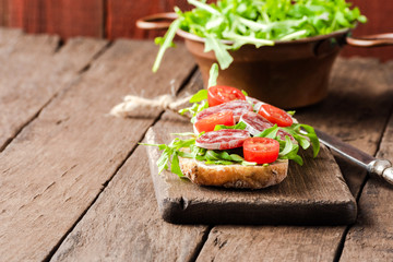 Tasty submarine sandwich on wooden table