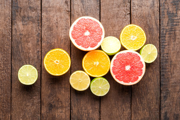 Fototapeta na wymiar Fresh citruses on wooden background