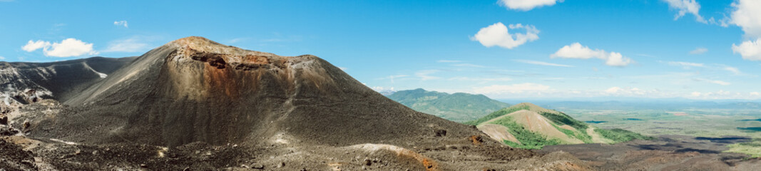 Nicaragua. Cerro Negro. Panorama of volcanoes on the background of bright blue sky