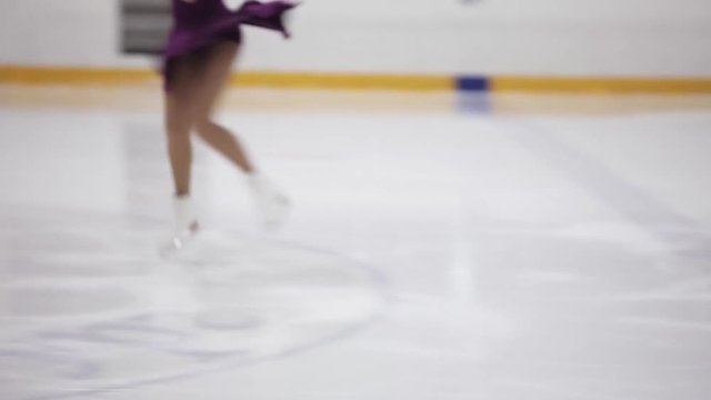 Figure skating, ice skating training. Feet skater on the ice, close-up,