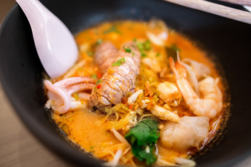 Close up of Thai Tom Yum seafood noodle