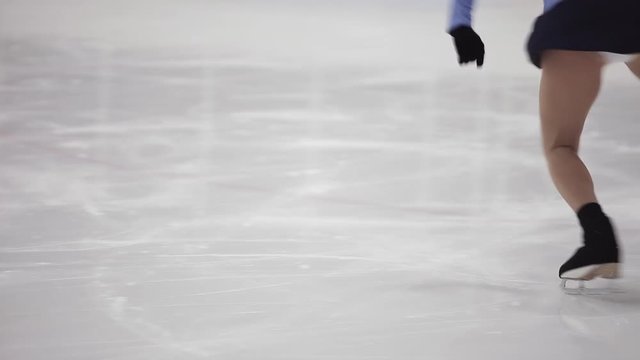 Figure skating, ice skating training. Feet skater on the ice, close-up,
